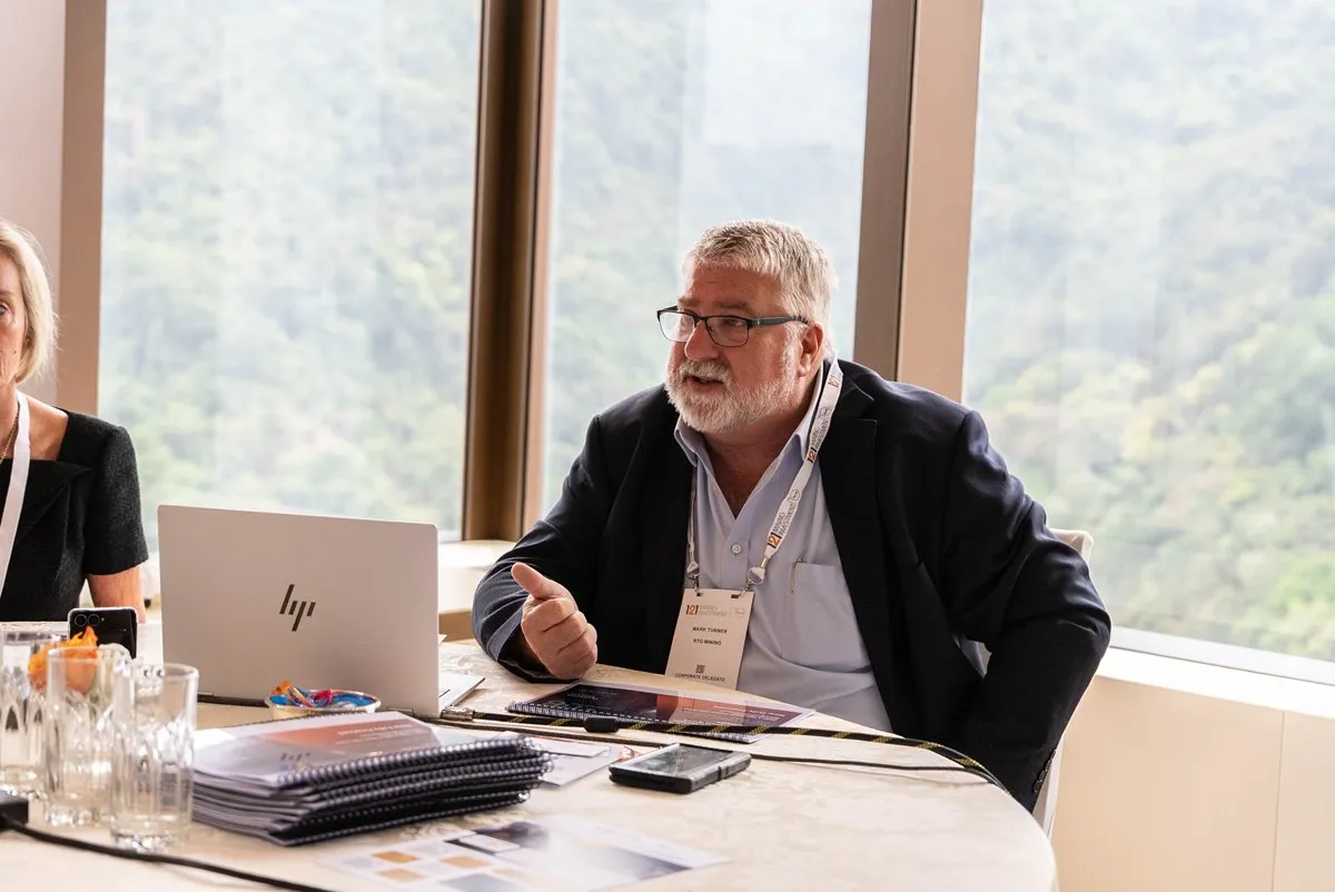 Mining company representative presenting a project during an investor meeting